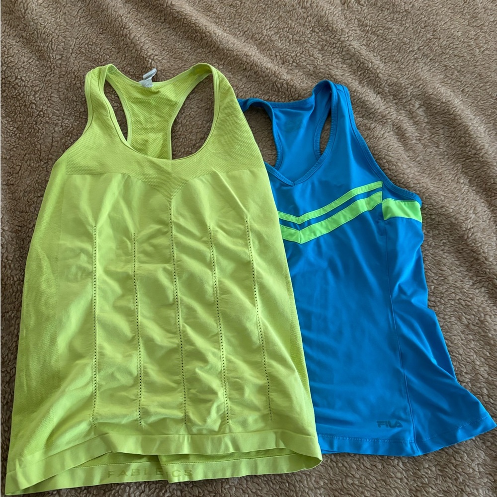 Two gym tops couple time worn, but still in good shape